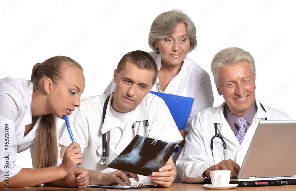 Doctors at the table exemining xray Doctors at the table exemining xray