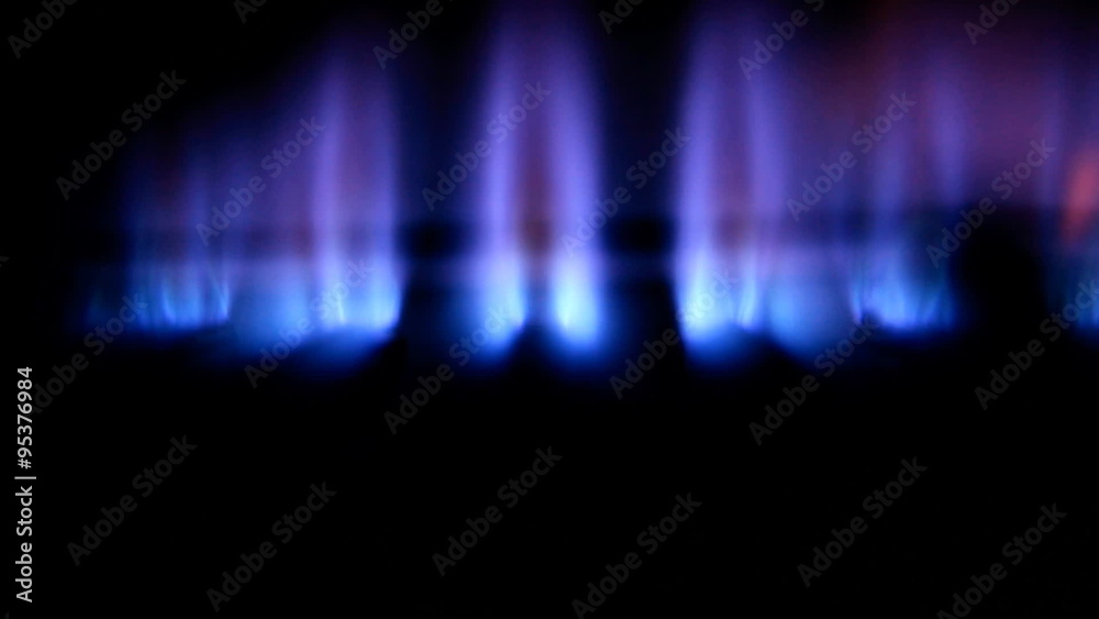 Blue flames of a gas burner inside of a boiler Blue flames of a gas burner inside of a boiler