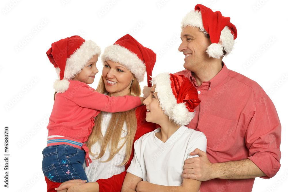 family with kids in santa hats family with kids in santa hats
