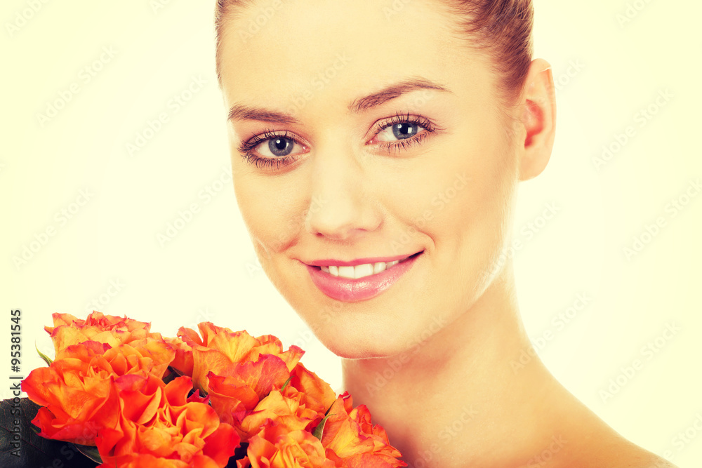 Fototapeta premium Smiling woman with fresh roses.