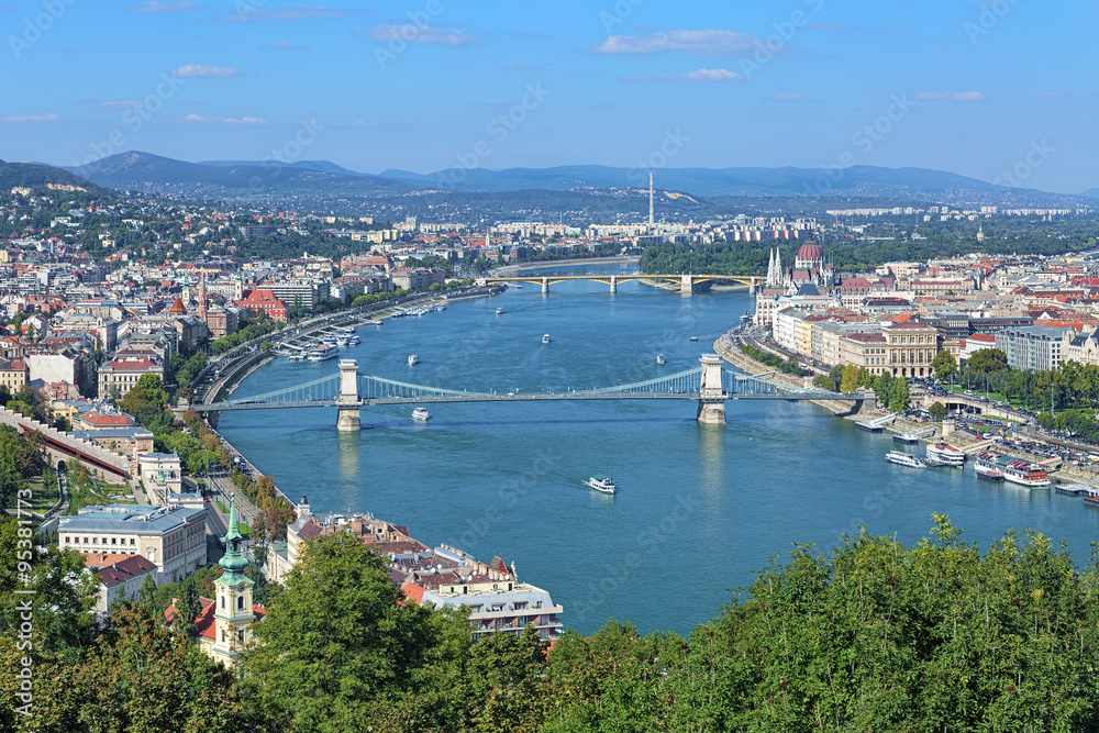 View of Danube with Szechenyi Chain Bridge and Hungarian Parliament Building from Gellert Hill in Budapest, Hungary