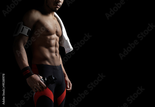 Athletic man on black background
