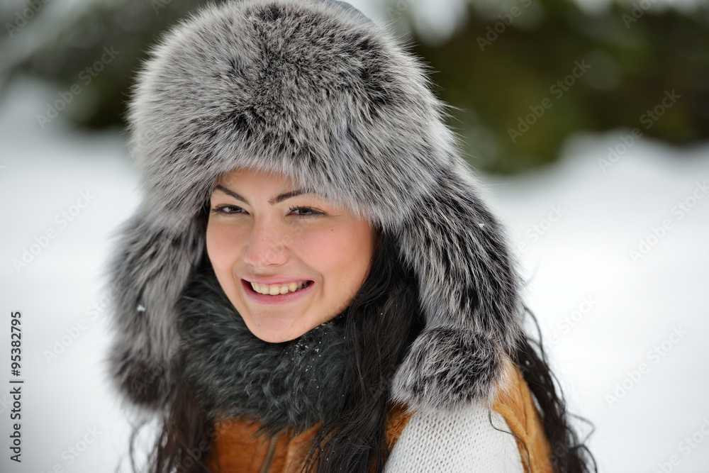 portrait of beautiful smiling female in luxurious fur head cloth portrait of beautiful smiling female in luxurious fur head cloth