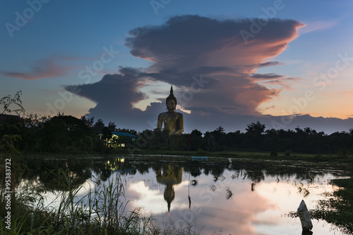 Sunset behind big image buddha in Thailand photo