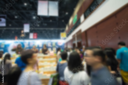 Abstract people walking in exhibition blurred background