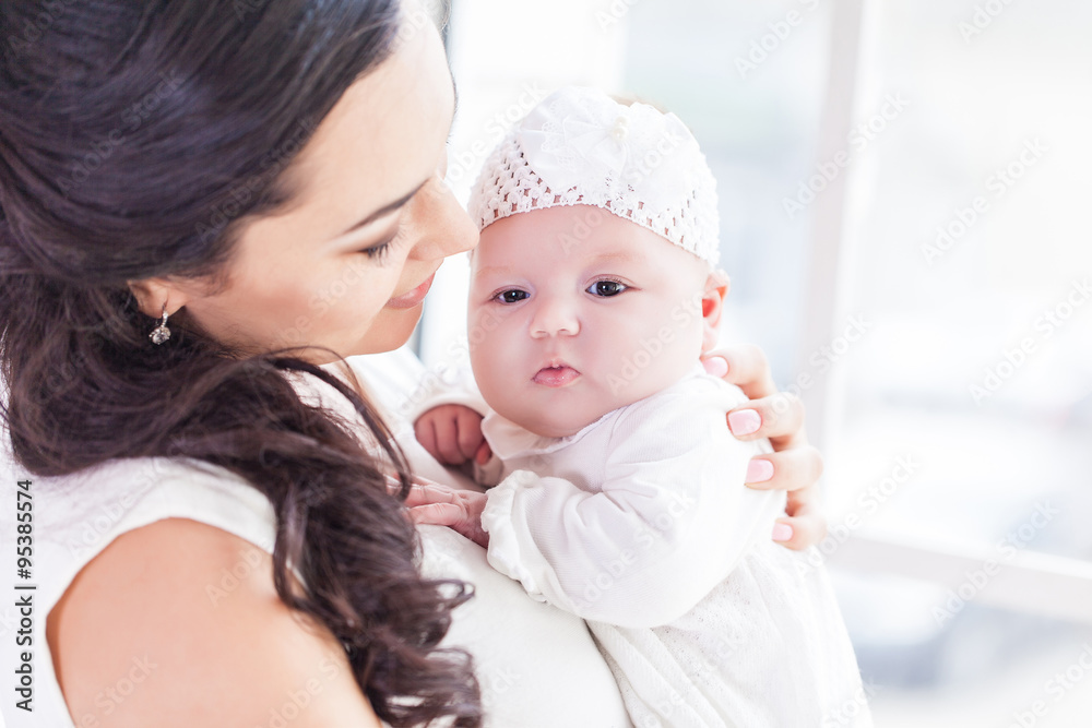Young happy beautiful mother with her little baby Young happy beautiful mother with her little baby