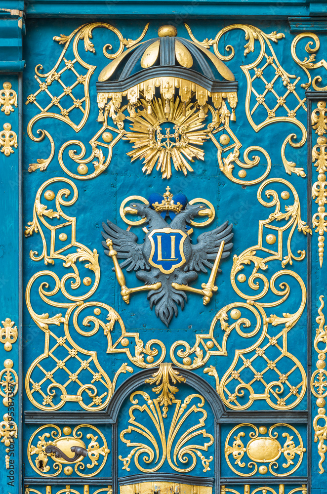 Blue door decorated with golden adornment Blue door decorated with golden adornment