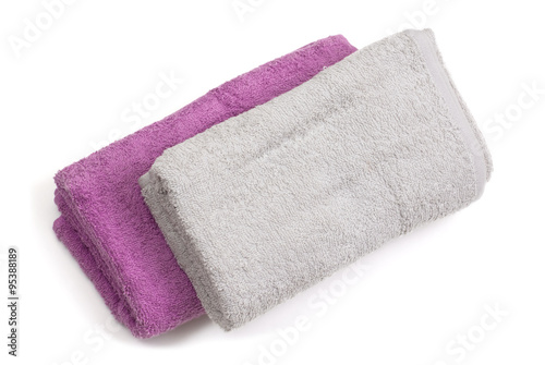 Towels and piece of soap isolated on white background