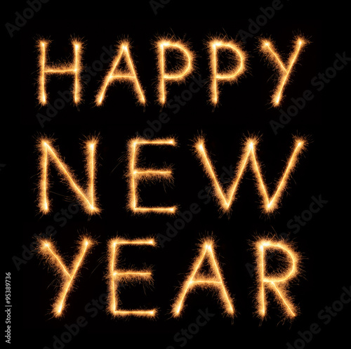 "HAPPY NEW YEAR" lettering drawn with bengali sparkles isolated on black background