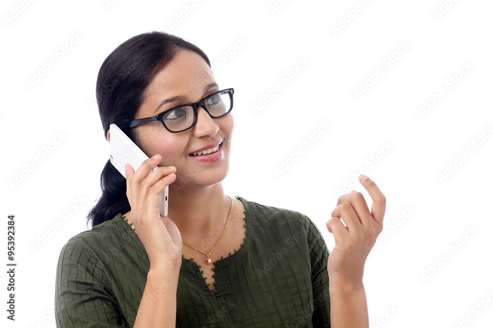Happy young woman talking on mobile phone Happy young woman talking on mobile phone