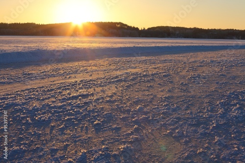 Frozen lake sunset