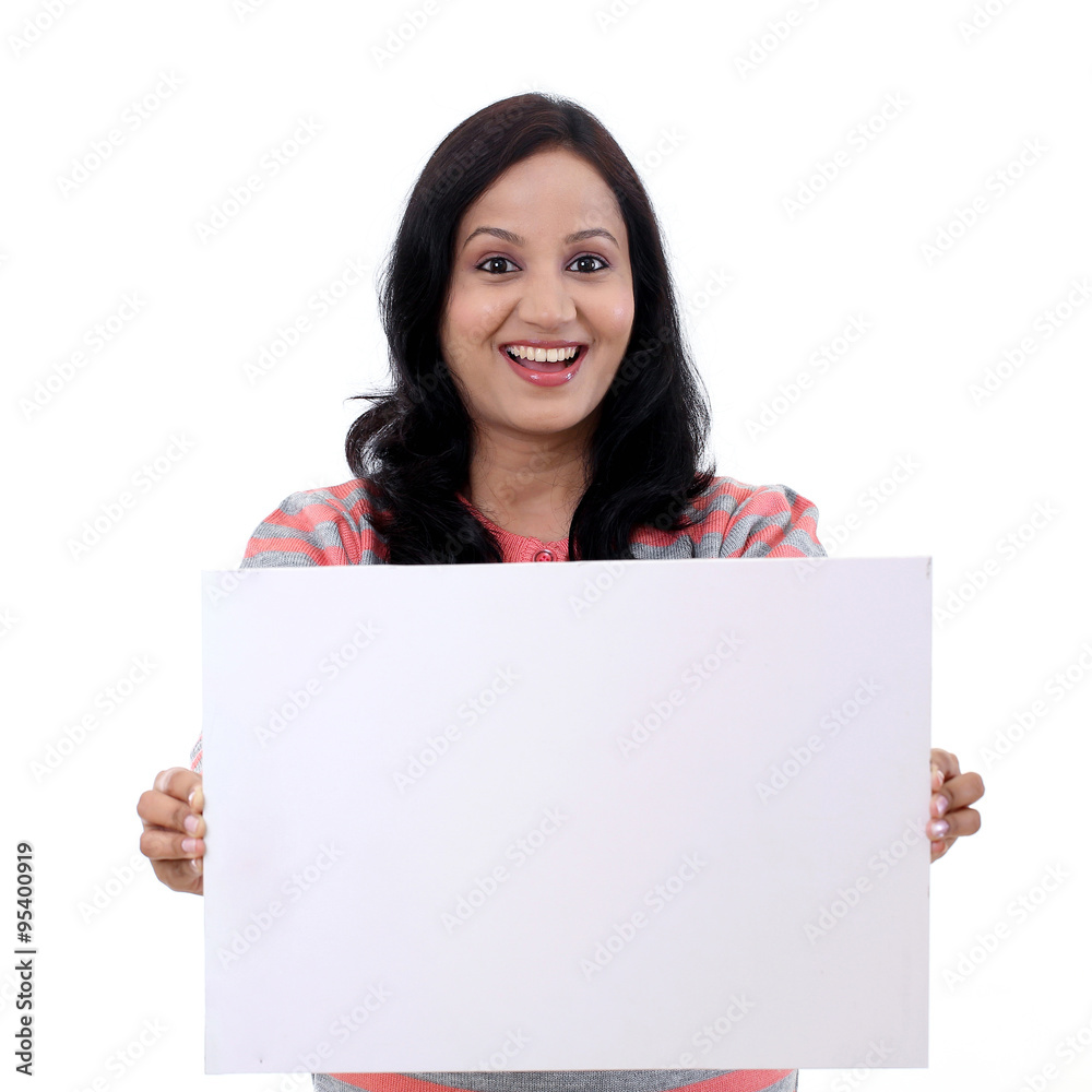 Excited young woman holding empty white board Excited young woman holding empty white board