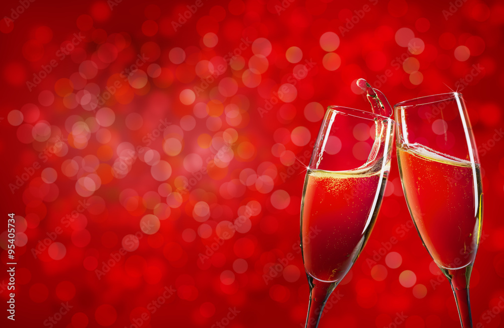 Two champagne glasses over red christmas background - obrazy, fototapety, plakaty 