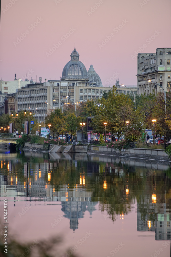 Bucharest, Romania - November 1, 2015: Dimbovita River and the CEC Palace along Splaiul Independentei(Independentei Avenue)