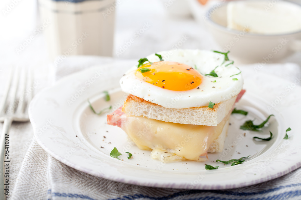 Croque madame, egg, ham, cheese sandwich. Traditional French cuisine. 