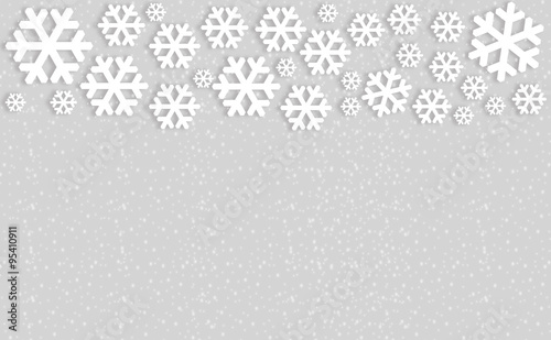 Snowflakes on gray background with copyspace.