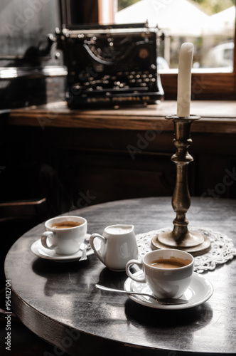 two coffee cups on table in cafe