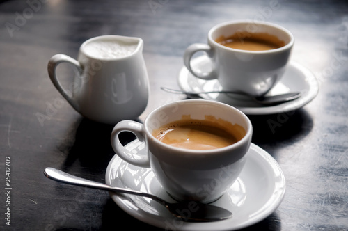 Photography two coffee cups on table in cafe