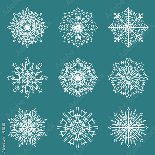 Set of 9 hand drawn symmetric white snowflakes