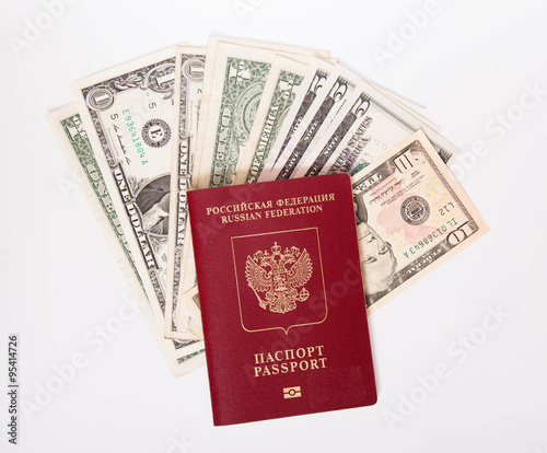 The Russian passport lies on a pile of notes (dollars)
