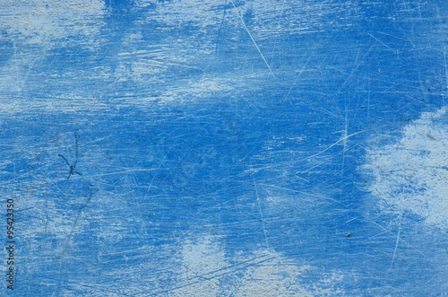 Trowel scratched background with dry plastering. Scratched blue texture.
