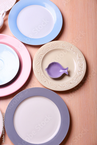 Composition of tableware on rosy background