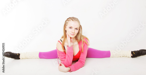 girl siting on gym split on white background 