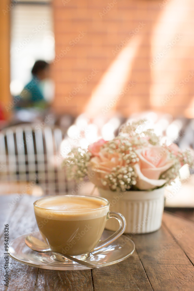 hot coffee and bouquet of flower on grunge wood table hot coffee and bouquet of flower on grunge wood table