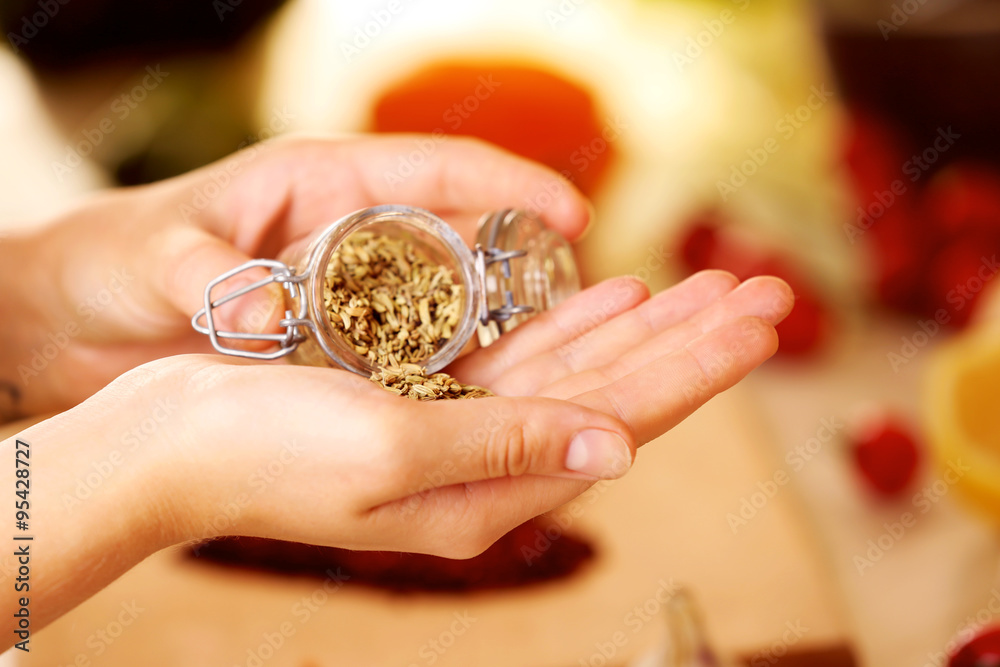 Mint in the jar and variety of spices on the kitchen table Mint in the jar and variety of spices on the kitchen table