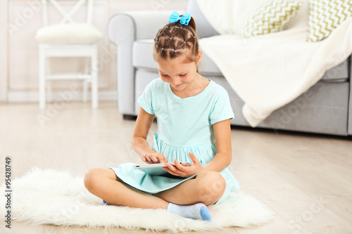 Little cute girl with digit...