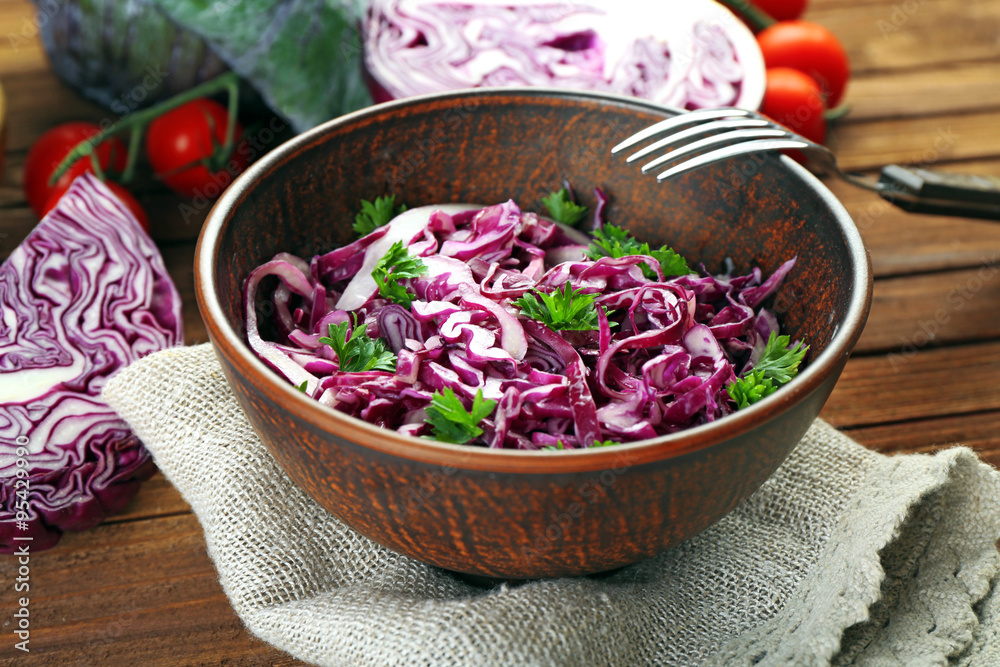 Red cabbage salad served in bowl closeup Red cabbage salad served in bowl closeup