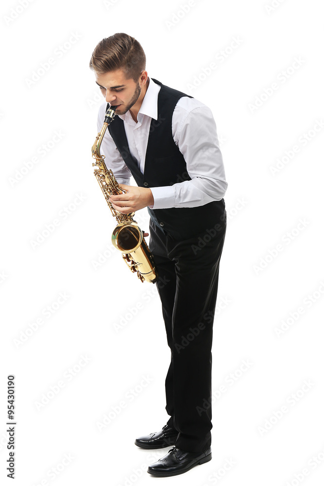 Fototapeta premium Happy saxophonist plays music on sax in elegant suit on white background