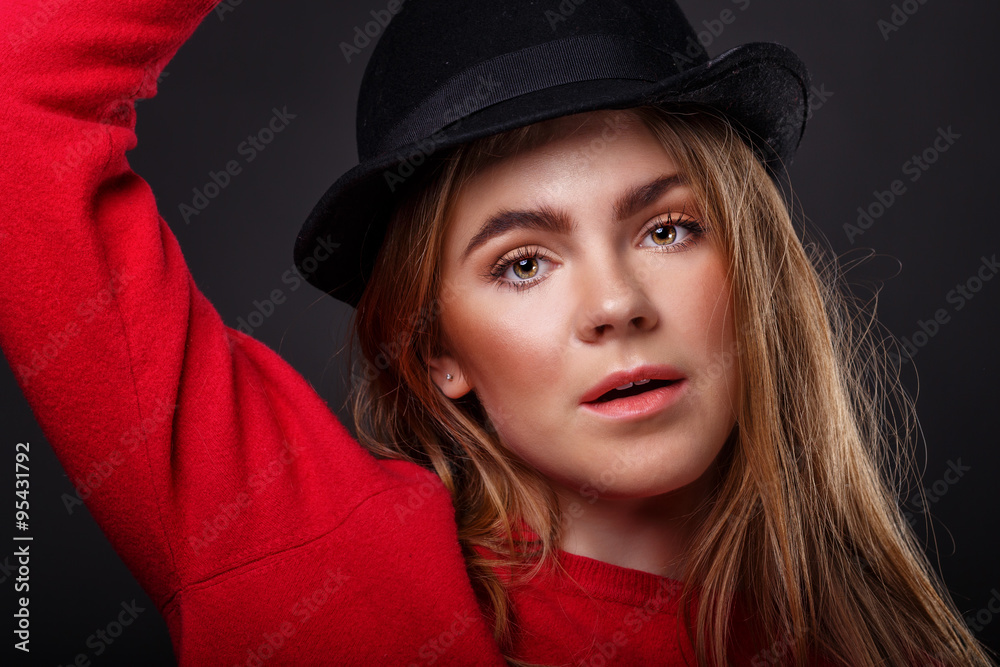 The girl in the hat. Close-up portrait. The girl in the hat. Close-up portrait.
