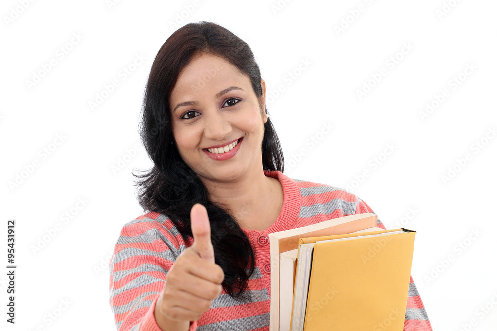 Cheerful female student with thumbs up gesture Cheerful female student with thumbs up gesture
