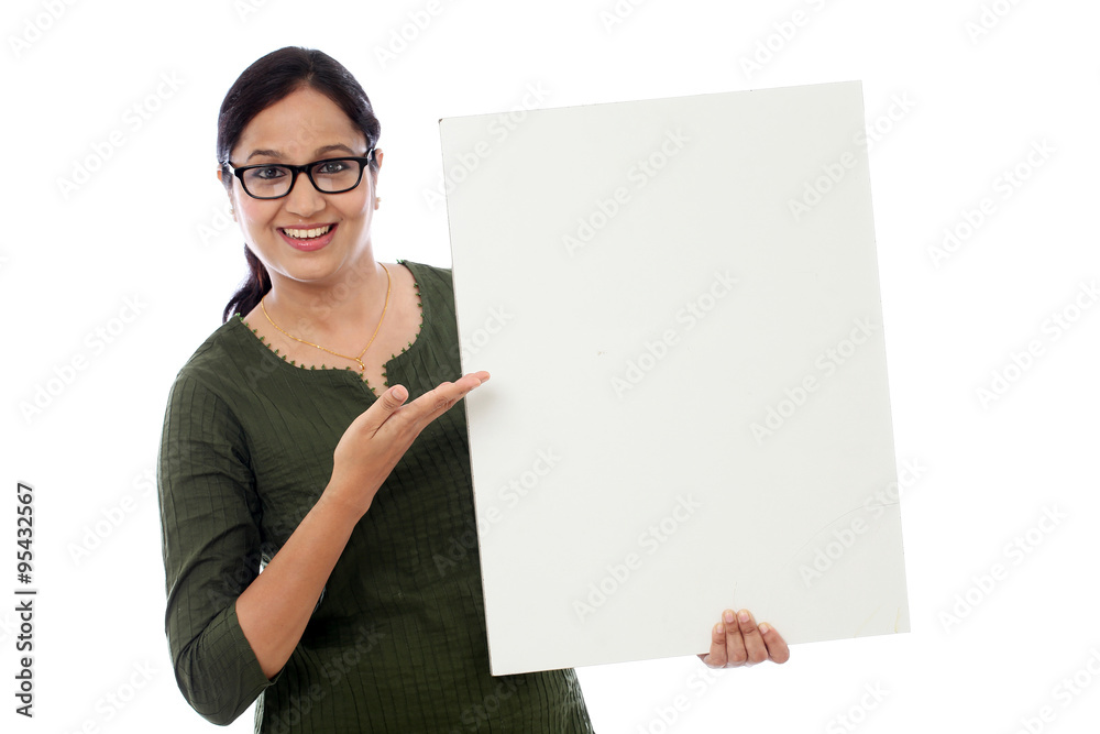 Young woman holding blank card against white background Young woman holding blank card against white background