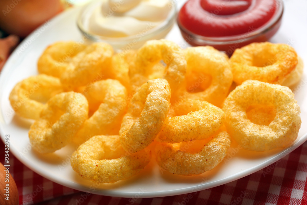 Chips rings with sauce on plate Chips rings with sauce on plate
