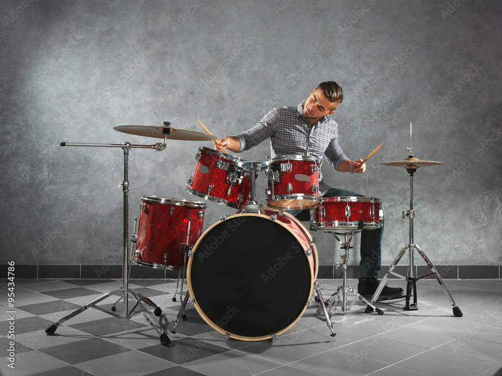 Fototapeta premium Musician playing the drums in a studio