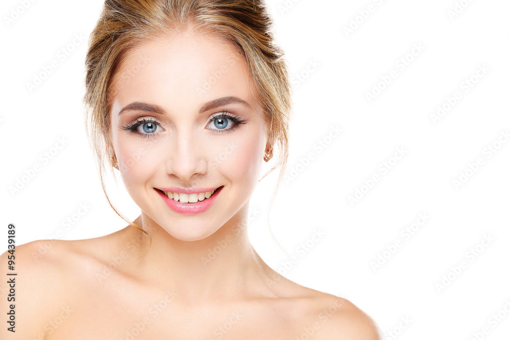 Studio shot of a beautiful young woman with perfect skin against a gray background Studio shot of a beautiful young woman with perfect skin against a gray background