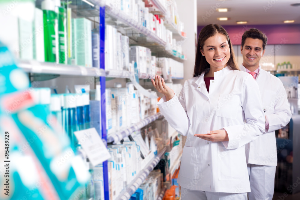Portrait of two friendly pharmacists working