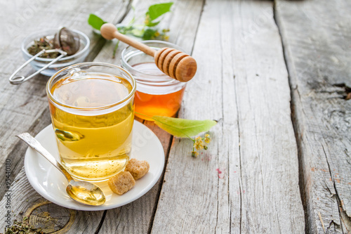 Herb tea in glass cup with honey