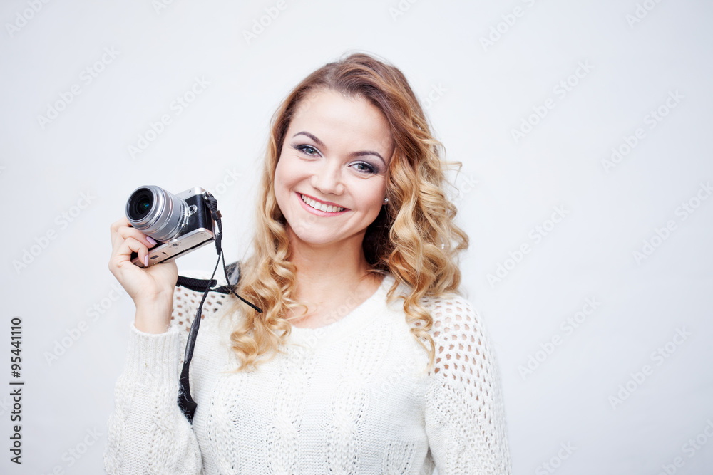 Fototapeta premium young woman photographer with camera, portrait on white background