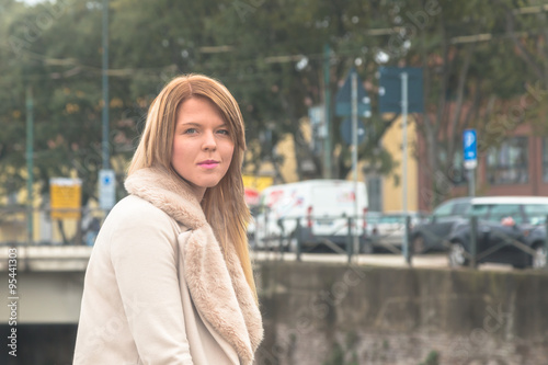 Beautiful girl posing in an urban context