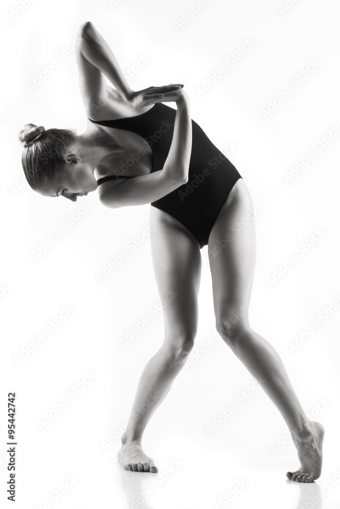 Fototapeta premium Modern ballet dancer posing on white background