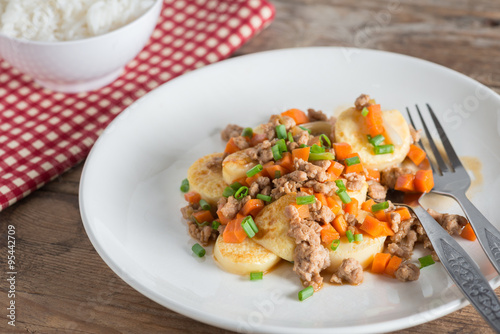 Stir fried tofu with minced pork and carrot ,onion in white plat