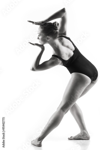 Modern ballet dancer posing on white background © Demian