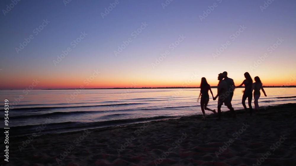 custom made wallpaper toronto digitalYoung people walking on the evening beach.