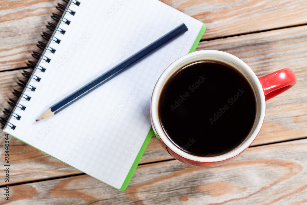 Coffee cup with notebook Coffee cup with notebook