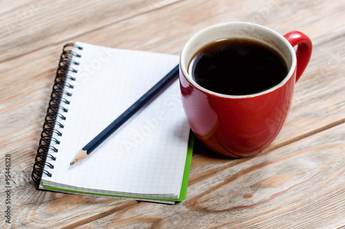Coffee cup with notebook