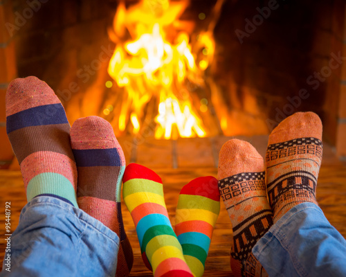 Obraz na plátně Family near fireplace