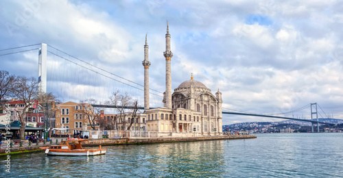 Ortakoy mosque and Bosporus bridge on European side in Istanbul, Turkey photo